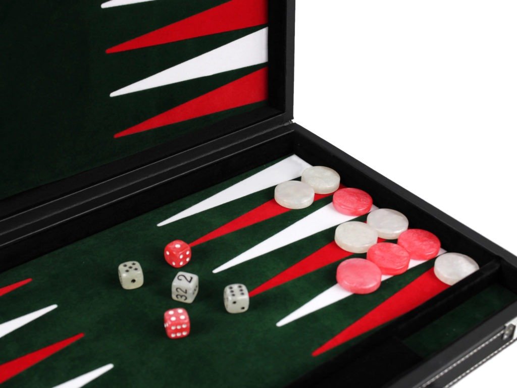 green felted backgammon board with red and white backgammon pieces