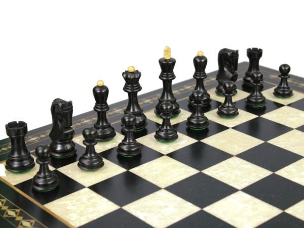 ebonised zagreb staunton chess pieces on black mother of pearl chess board