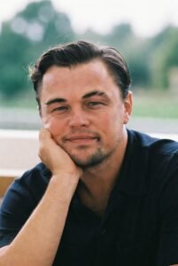 Alt text: Celebrities in intense backgammon game, immersed in strategic play, with luxurious setting.